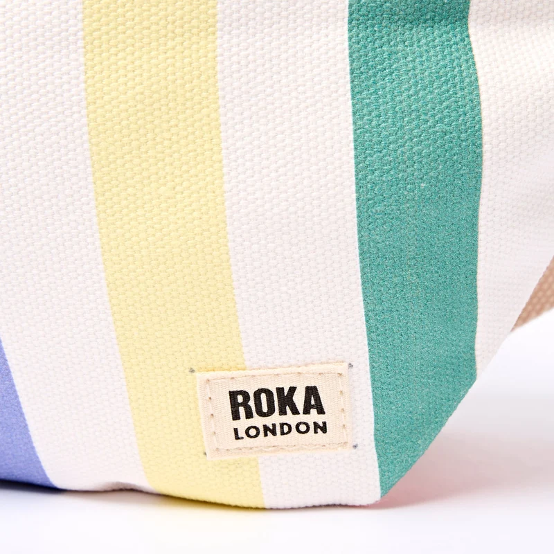 ROKA Mill Hill Umhängetasche aus Baumwoll-Canvas | Pastellfarbenes Streifenmuster