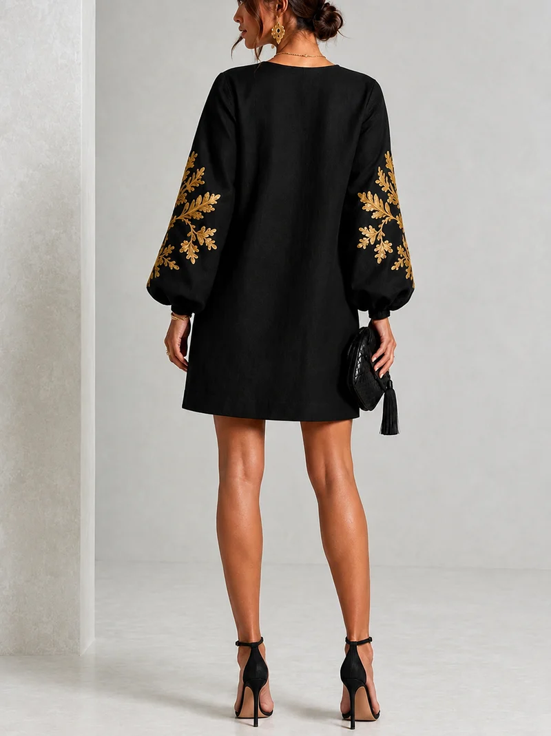 Eisele | Lockeres schwarzes Minikleid mit goldenen Blumendetails