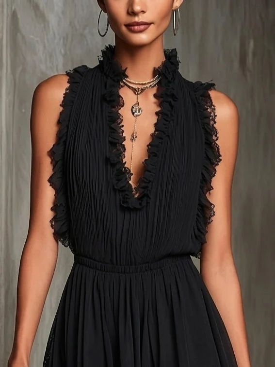Noiréa | Schwarzer Chiffon-Jumpsuit mit Plissee und Rüschen