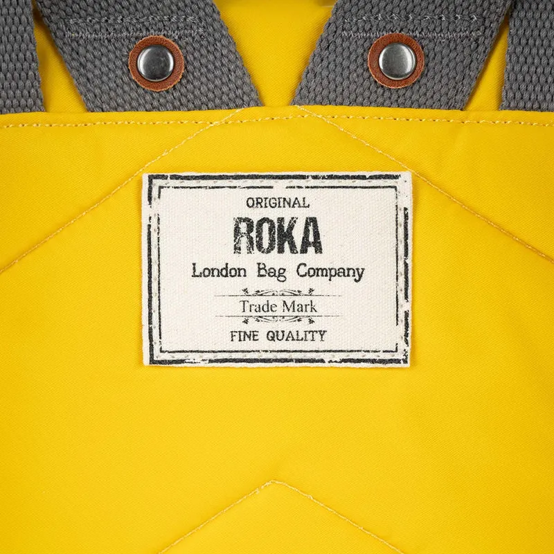 ROKA Canfield B Senffarbene kleine Tasche aus recyceltem Nylon