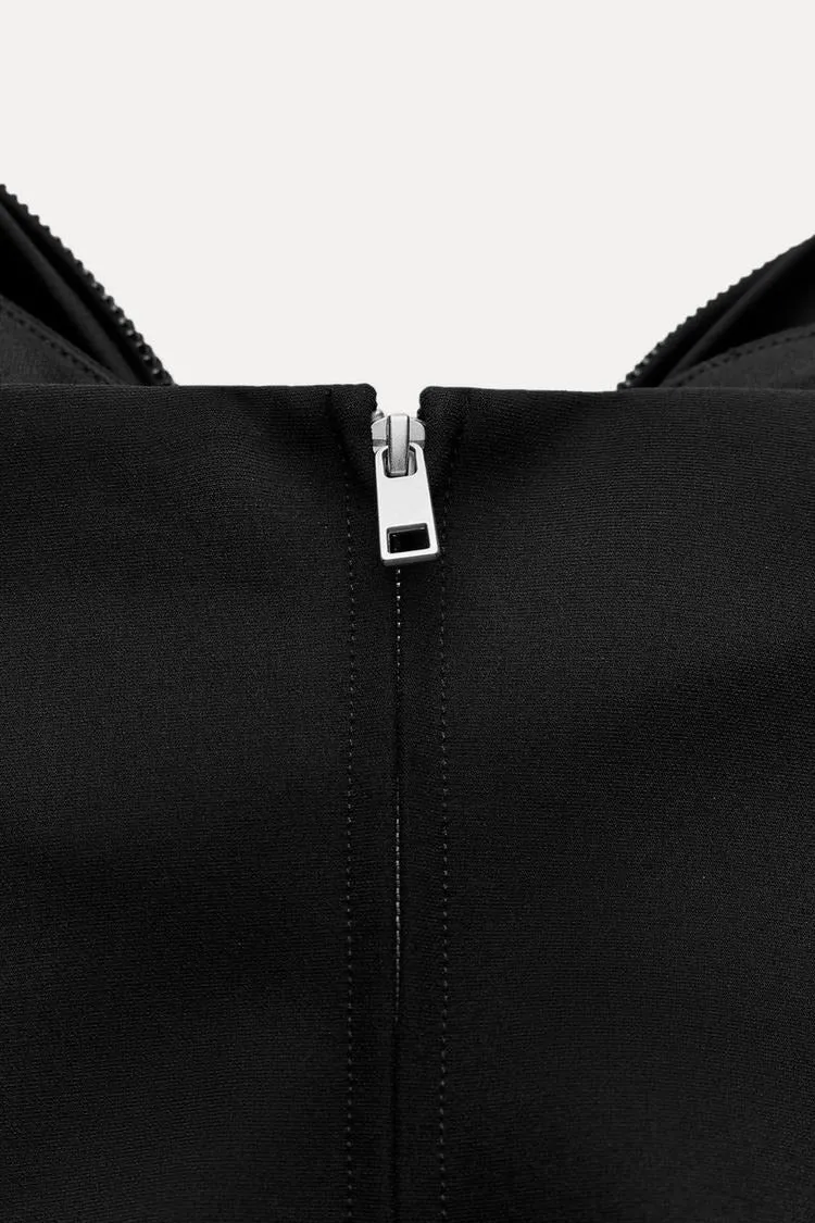 Damen-Top mit Schleifendetail und Glitzer-Struktur
