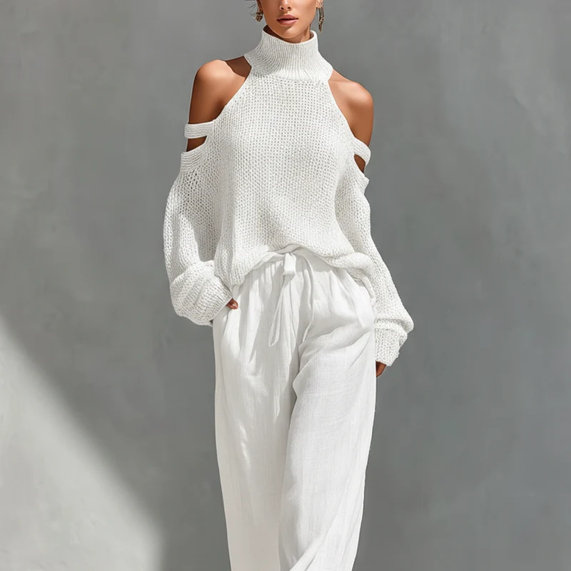 Set aus einem gestrickten Damen-Rollkragenpullover mit Cold-Shoulder-Ausschnitt und einer Hose mit weitem Bein