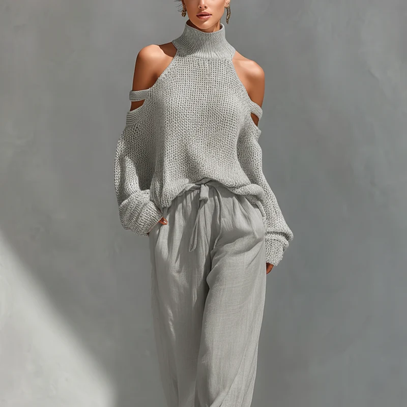 Set aus einem gestrickten Damen-Rollkragenpullover mit Cold-Shoulder-Ausschnitt und einer Hose mit weitem Bein